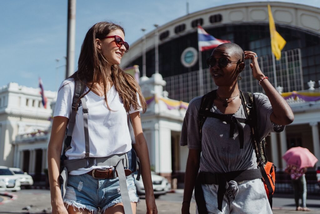 pexels-photo-4881009-4881009 Two women travelers enjoying a sunny day exploring a new city.